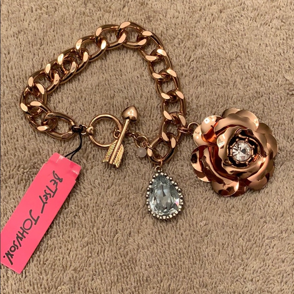 Betsy Johnson rose gold tone bracelet with charms